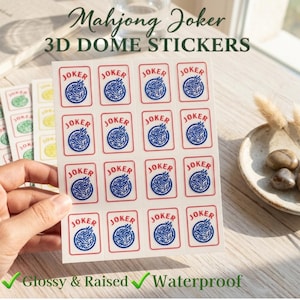 May include: Sheets of Mahjong Joker 3D dome stickers. Each sticker features a red border with the word "JOKER" and a blue and white design. The stickers are glossy, raised, and waterproof.