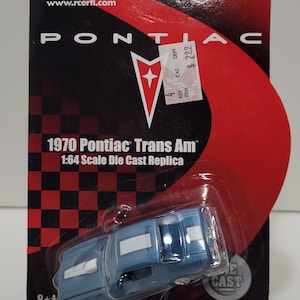 May include: A blue 1970 Pontiac Trans Am die-cast replica, 1:64 scale, in its original packaging. The packaging is red and black with the words "Racing Champions" and "Concept and Muscle".