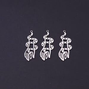 May include: Three identical silver-toned metal charms, each featuring a cutout design of a hand entwined by a snake. The snake body is decorated with small circular and diamond-shaped perforations. Each charm includes a small loop at the top.