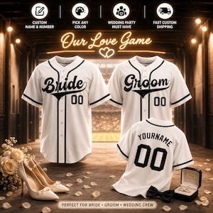 May include: Three white baseball jerseys with black trim and buttons. Two jerseys feature the text Bride and Groom with the number 00. The third jersey displays the text YOURNAME and the number 00. The text Our Love Game is visible above.