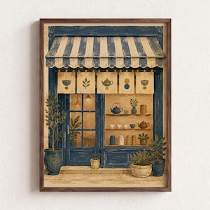 May include: A framed wall art print depicting a storefront with a blue and white striped awning. The shop features a glass door, a display window with shelves holding teapots and jars, and five hanging banners with icons of tea and plants.