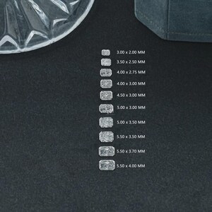 May include: A set of three ceramic mugs with a speckled, matte finish. The mugs are in shades of cream, light gray, and dark gray. Each mug has a simple, minimalist design, perfect for coffee or tea.