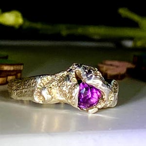 Silver ring with natural purple fluorite stone which helps to balance the energies of the body and mind.