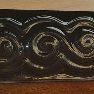 Gloss Black Ceramic Accent Tile – Raised Wave Design, 1.5x6" Border Tile