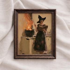 May include: A framed wall art print depicting a figure in a pointed hat and dark dress standing before a stove. The figure holds a book and a wand, while a large black cauldron sits on the stove with bright orange flames rising from it.