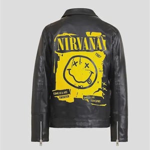 May include: Black faux leather jacket with a yellow Nirvana graphic on the back. The graphic features a smiley face with crossed-out eyes and a tongue sticking out, along with the band's name and song lyrics.