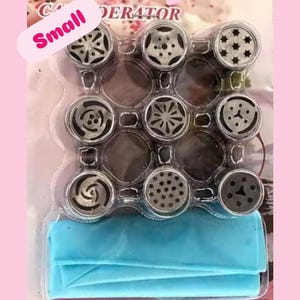 May include: A package of Russian piping tips with various decorative designs. The package includes multiple stainless steel tips and a blue pastry bag. Text on the package reads "Russian piping tips" and "Small".