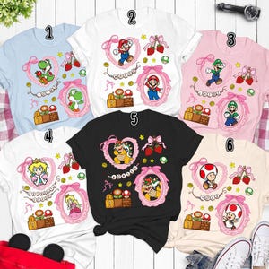 Camiseta de Super Mario con lazos coquetos, camiseta de la película Mario Galaxy, Yoshi, Mario Princess Beach, mini Bowser, Toad, Luigi, camiseta familiar Epic Universe 03 imagen 2