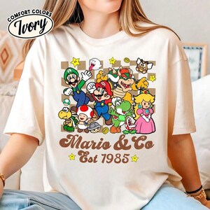 Disneyland Mario Est 1985 Shirt, Mario Galaxy Movie Shirt, Mario Luigi Princess Peach Shirt, Epic Universal Family Group Matching Tee 13 image 3