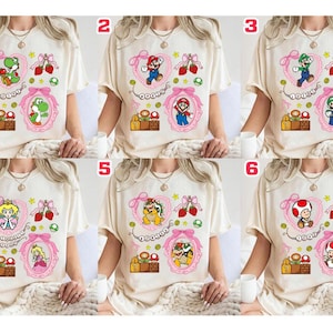 Camiseta de Super Mario con lazos coquetos, camiseta de la película Mario Galaxy, Yoshi, Mario Princess Beach, mini Bowser, Toad, Luigi, camiseta familiar Epic Universe 03 imagen 1