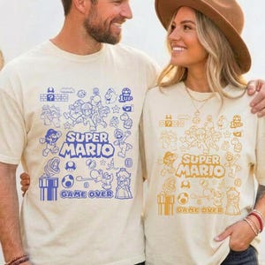 Camiseta con arte de garabatos de Mario y sus amigos Camiseta de la película Mario Galaxy Camiseta de la familia Super Mario Camiseta de los videojuegos de Disneyland Mario Camiseta del universo épico imagen 1