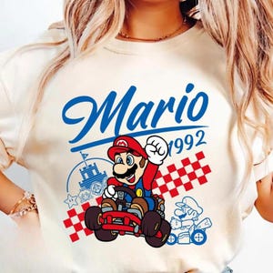 Vintage Super Mario 1992 Shirt Mario Galaxy Movie Shirt Super Mario Family Shirt Disneyland Mario Video Games Shirt Epic Universe Shirt 12 Bild 1