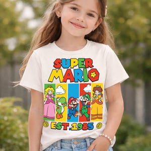 Cusotm Disneyland Mario Est 1985 Shirt, Mario Tee, Super Daddio Mommio Kiddo Shirt, Epic Universal Family Group Matching Tee 00 bild 1