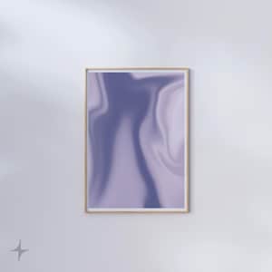 May include: A framed abstract art print with a flowing, marbled design in shades of lavender and periwinkle. The artwork is encased in a light wood frame, creating a modern aesthetic. The print is mounted on a white wall.