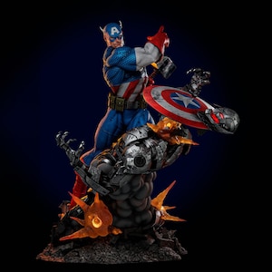 May include: A detailed statue of Captain America in a dynamic pose, wielding his shield and hammer. The figure is clad in a blue, white, and red costume, battling a metallic, robotic foe. The base features fiery orange and gray elements.