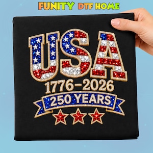 May include: Black canvas with a patriotic design. The word "USA" is prominently displayed in red, white, and blue, with the years "1776-2026" and "250 YEARS" below. Gold accents and stars complete the design.