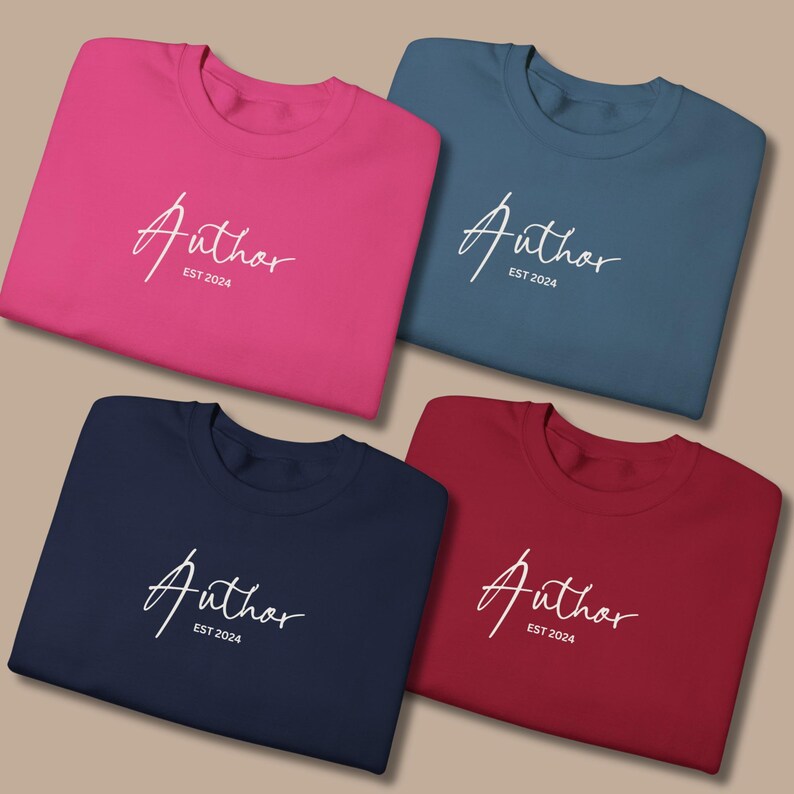 May include: Four crewneck sweatshirts in different colors: hot pink, blue, navy, and red. Each sweatshirt has the word "Author" in a white script font, with "EST 2024" below it.