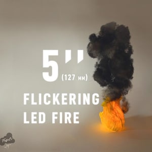 May include: A 5-inch (127 mm) flickering LED fire effect. The image shows a simulated flame with an orange glow at the base, transitioning to black smoke. Text on the image reads "Flickering LED Fire".