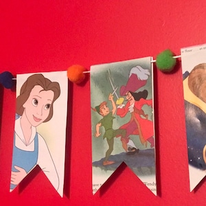 Storybook reversible large pennant banner with pom poms for nursery decor, baby shower, and more