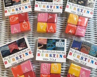 May include: Four bags of Starburst sweets with book club themed gift tags. Each tag has a different book cover and the text "My Book Club has me BURSTING with JOU!"
