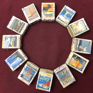 Twelve Map Mini Guest Soaps with vintage travel posters for wedding, travel theme party, retirement party, going away party and more