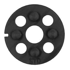 May include: A black, circular object with a central hole and six smaller holes. The object has three raised, rounded bumps and the letters "STD" are visible. The object is likely a part or component.