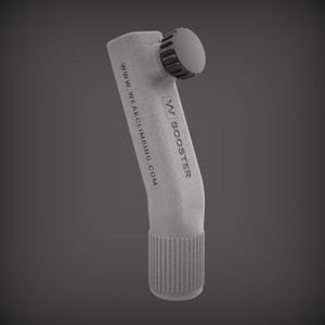 May include: A gray climbing booster with the text "BOOSTER" and "www.weakclimbing.com". The booster has a ridged base and a circular top with a gear-like design. The product is designed for climbing.