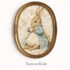 May include: An oval, gold-framed print featuring a watercolor illustration of a rabbit in a blue coat and white dress, holding a teacup. The background has a floral pattern. The text "Kanvas Kids" is at the bottom.