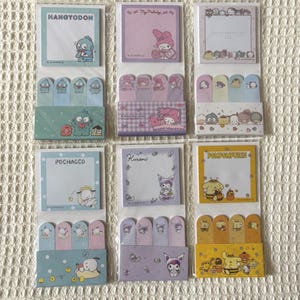 May include: Nine sets of sticky notes featuring various Sanrio characters. Each set includes a square notepad and several rectangular page markers. The notepads have different colored backgrounds and character illustrations, including Hangyodon, My Melody, and Pompompurin.