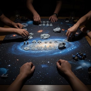 May include: A board game in play, with a galaxy-themed mat as the game surface. Miniature spaceships and asteroid models are arranged on the mat. Players' hands are visible, interacting with the game pieces. The scene is dimly lit, creating a focused atmosphere.