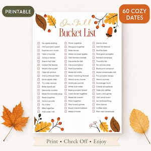 May include: A printable fall bucket list featuring the text Our Fall Bucket List and 60 cozy dates with checkboxes. The document is decorated with illustrations of autumn leaves, berries, and acorns in shades of orange, brown, and yellow.