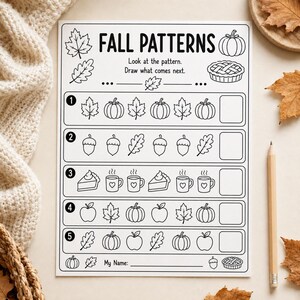 May include: A white educational worksheet titled FALL PATTERNS with black line art illustrations of leaves, pumpkins, acorns, pie, and mugs. The page features five numbered rows for completing sequences and a line for a name at the bottom.