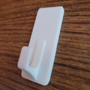 May include: A set of three ceramic mugs with a speckled, matte finish. The mugs are in shades of cream, light gray, and dark gray. Each mug has a simple, minimalist design, perfect for coffee or tea.