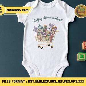 May include: White baby bodysuit with a colorful graphic of a shopping cart filled with various items, including a birdcage and lavender. The text "Thrifting Adventures Await!" is above the cart. The image also includes the text "EMBROIDERY FILES".