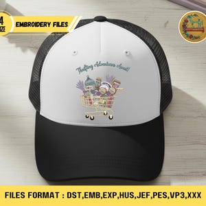May include: A black and white trucker hat with a white front panel featuring a shopping cart graphic filled with thrifted items. The text "Thrifting Adventures Await!" is above the cart. The hat has a black mesh back and a black brim.