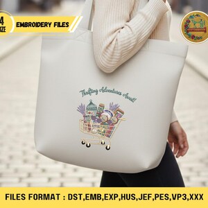 May include: A cream-colored tote bag with the text "Thrifting Adventures Await!" and a shopping cart graphic filled with various items. The bag also features the text "EMBROIDERY FILES" and "4 SIZE".
