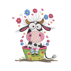 May include: An embroidered design of a cartoon cow sitting in a flower pot. The cow is black and white with large eyes and a pink nose. The flower pot is green with pink and yellow accents, and the design includes pink, blue, and yellow flowers.