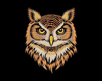 May include: Embroidered owl head with detailed feathering in shades of brown, gold, and cream against a black background. The owl has large yellow eyes and a yellow beak. The design is symmetrical and centered.