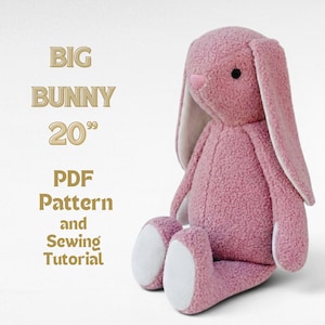 May include: A soft pink bunny toy with long ears and white details. The bunny is about 51 cm tall, with a pink nose and black eyes. Text on the left reads "BIG BUNNY 20" PDF Pattern and Sewing Tutorial."