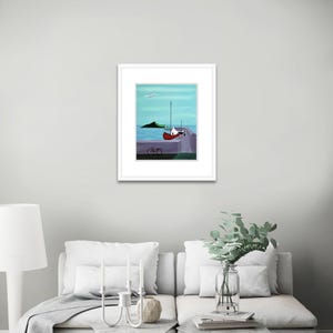 May include: A framed print featuring a painting of a red boat docked at a pier with a bicycle parked nearby. The scene includes a calm blue sea, a distant green island, and a light blue sky with a single white bird flying above the water.