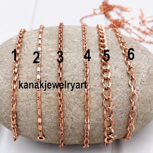 May include: Six rose gold-toned metal chains of varying link styles are displayed, labeled with numbers one through six. The text kanakjewelryart is printed on the surface. Each chain features a distinct pattern of interconnected metallic links.
