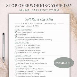 May include: A printable PDF checklist titled "Soft Reset Checklist" with the text "Stop Overworking Your Day." The checklist includes sections for Gentle Morning Start, Soft Productivity, Mental Load Check, and Gentle Evening Close. A pen rests on the left side.