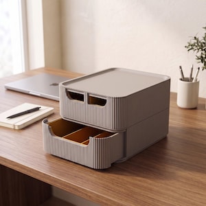 May include: A rectangular, taupe-colored plastic storage organizer with a ribbed exterior texture. The unit features a top lid and a single pull-out drawer that is divided into three internal compartments with a mustard-yellow interior finish.