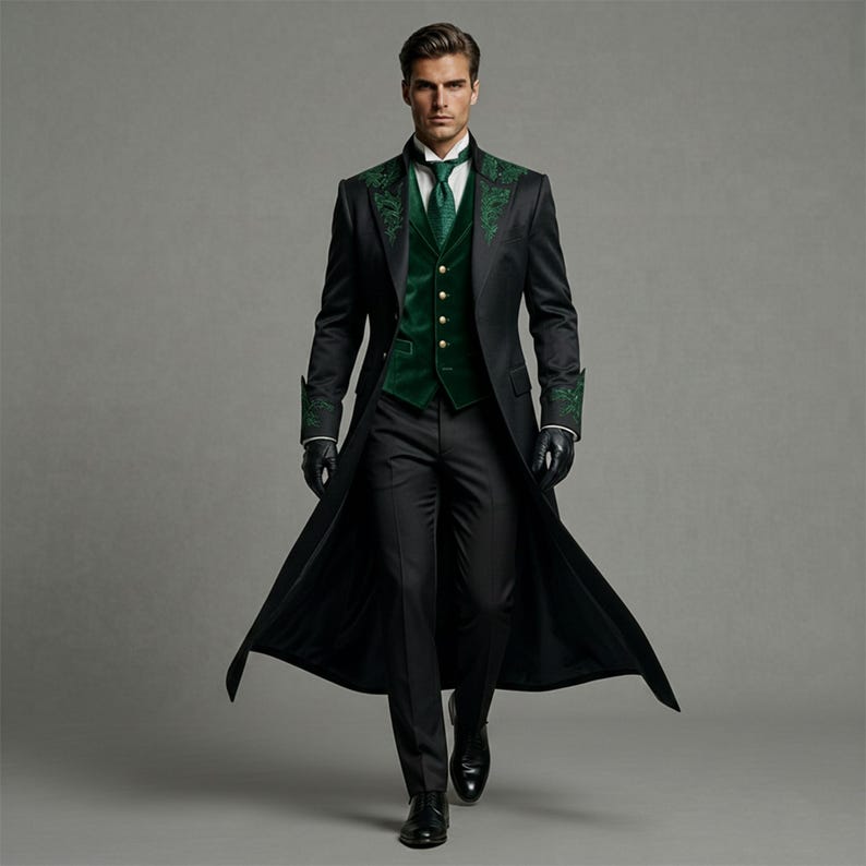 May include: A formal black suit with a long coat, green velvet vest, and matching tie. The coat features green embroidered detailing on the lapels and cuffs. The ensemble is completed with black gloves and dress shoes.