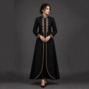 May include: A long black coat featuring gold embroidery on the collar, cuffs, and edges. The coat has a high collar and a flowing, floor-length design. The gold embroidery provides an elegant touch to the garment.