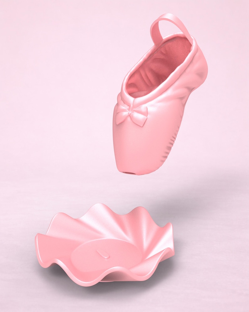 May include: A light pink ballet slipper with a small bow detail on the toe, positioned above a matching light pink circular dish with a ruffled, wavy edge. Both items feature a smooth, matte finish and a uniform, solid pastel color throughout.