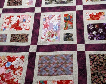 Patchworkquilt van levendige stoffen in Japanse stijl