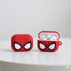 Peut inclure: Étuis rouges pour AirPod Pro sur le thème de Spider-Man. Un étui est fermé, l'autre est ouvert, révélant des écouteurs blancs. Les étuis présentent un motif de toile d'araignée noire et de grands yeux blancs, imitant le masque du super-héros.