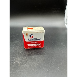 May include: A vintage Schilling Ground Turmeric tin. The tin has a white top and a red bottom with the brand name and product information. The net weight is 1.37 oz.