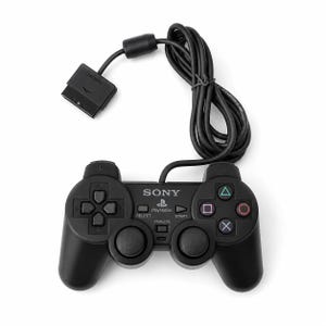 May include: A black Sony PlayStation wired game controller featuring a directional pad, two analog sticks, four action buttons with geometric symbols, and center buttons labeled Select, Start, and Analog, with a long black cable attached.
